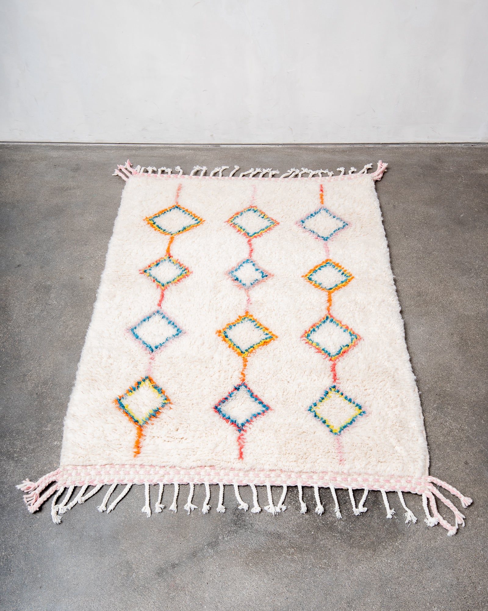 Modern, designer, handcrafted Berber rug from Morocco. Beniourain carpet with beautiful colours and patterns and fluffy wool texture.